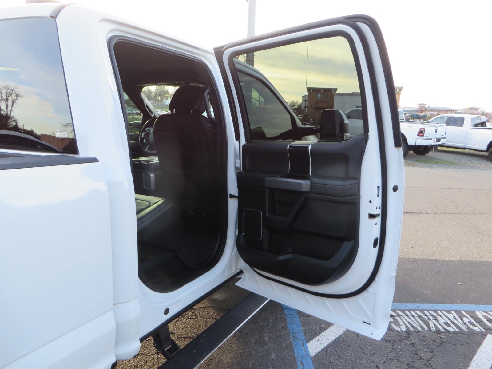2020 White /BLACK Ford F-450 SD PlatinumCrew Cab DRW 4WD (1FT8W4DT4LE) with an 6.7L V8 OHV 16V DIESEL engine, 6A transmission, located at 2630 Grass Valley Highway, Auburn, CA, 95603, (530) 508-5100, 38.937893, -121.095482 - Must see F450 with a tool box refueling station, window tint, and a center console vault. - Photo #52